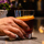 Man holding a cocktail on a bar