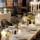 Long table laid at Corrigan's Mayfair with flower centrepieces and candles