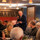 Gentleman speaking into a microphone in a restaurant