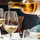 Wine being poured into two wine glasses on a table